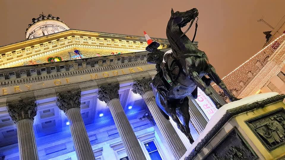 The Duke of Wellington statue in front of Glasgow's Gallery of Modern Art at night